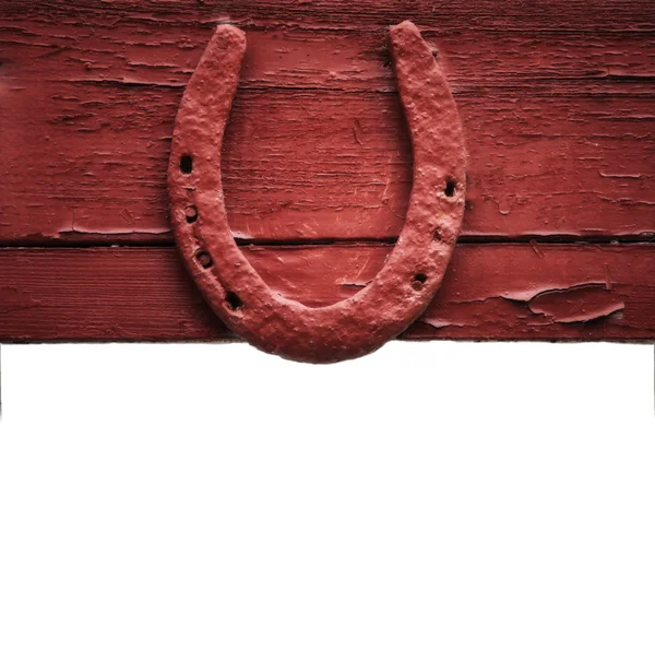 Gamla horseshoe hängande på trävägg — Stockfoto