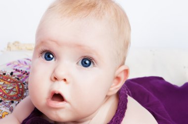 Portrait of lovely blue-eyed baby girl clipart