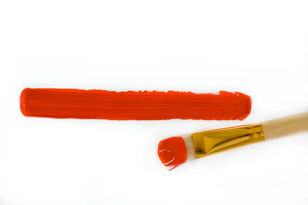 Brush draws a red line — Stock Photo, Image