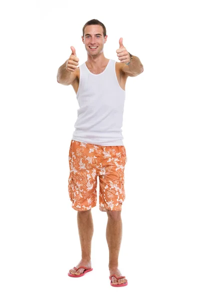 Full length portrait of resting on vacation smiling young guy sh — Stock Photo, Image