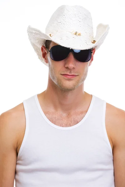 Portrait of young man in sunglasses and holiday hat — Stock Photo, Image