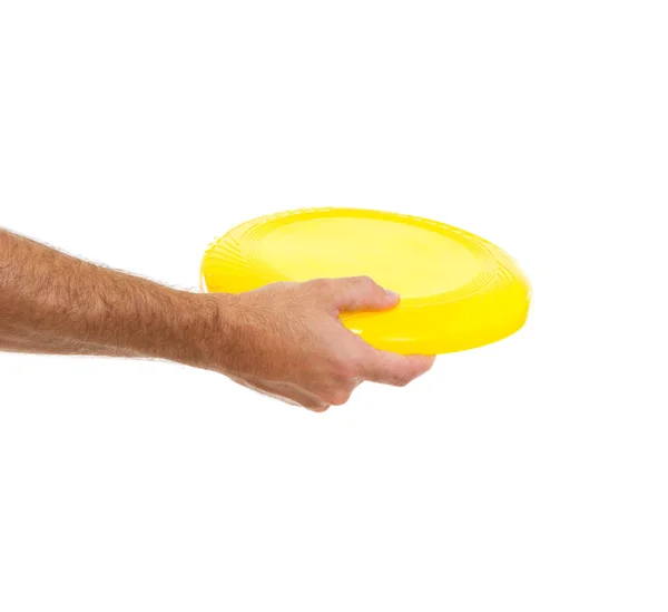 stock image Closeup on flying disc in male hand isolated on white