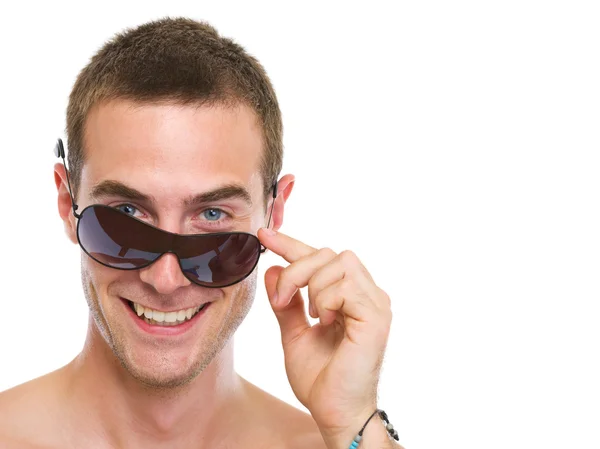 Portrait of smiling young guy with sunglasses — Stock Photo, Image