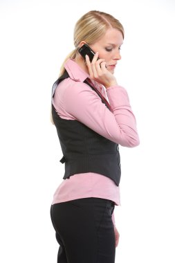 Woman employee speaking mobile phone. Side view clipart