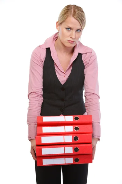 Zmęczona kobieta ze stosem folderów — Zdjęcie stockowe