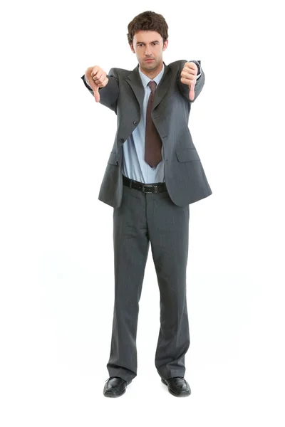 Teljes hossza portréja üzletember mutatja a hüvelykujját lefelé — Stock Fotó