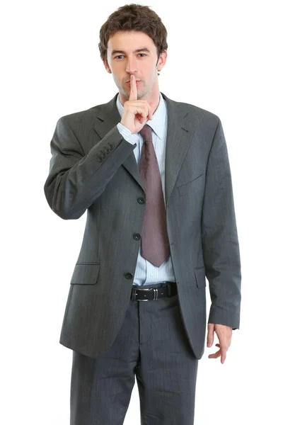 Modern businessman showing shh gesture — Stock Photo, Image