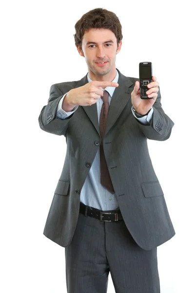 Modern businessman pointing on cell phone — Stock Photo, Image