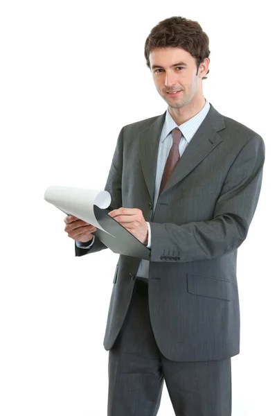 Modern businessman writing in clipboard — Stockfoto