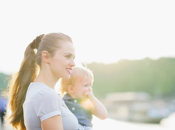 Portrait of mother and baby looking on copy space — Stock Photo, Image