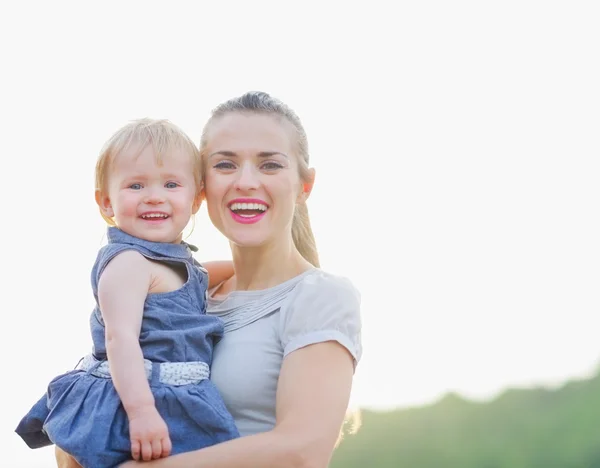 Portrait of smiling mom and baby — Stock Photo, Image