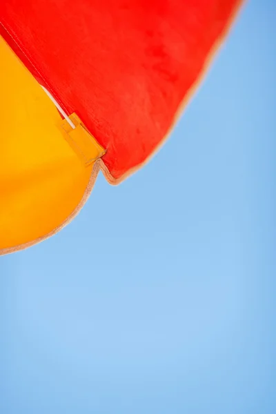 stock image Vacation background. Blue sky and colorful beach umbrella