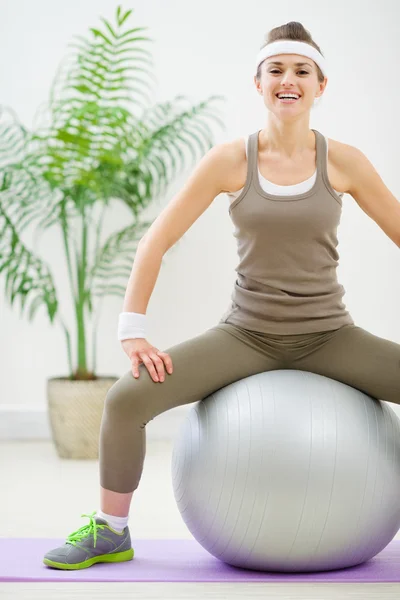 Fitness woman sitting on fitness ball — Stok fotoğraf