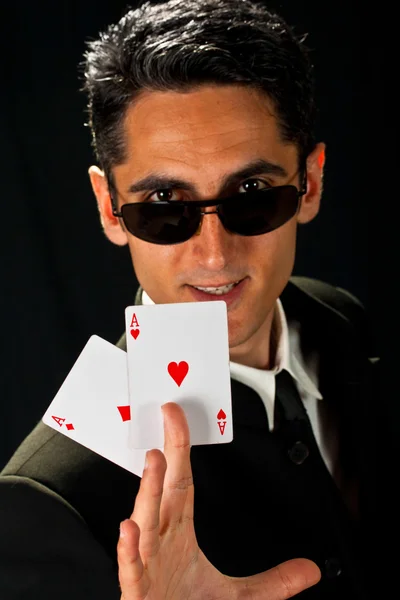 Young lucky gambler with cards — Stock Photo, Image