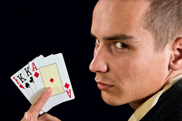 Young lucky gambler with cards — Stock Photo, Image