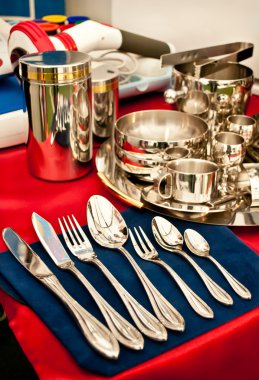 Stainless steel cutlery and cups clipart