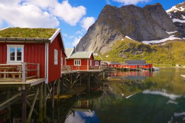 Fishing huts with sod roof clipart