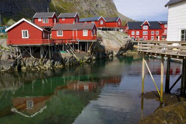 Red rorbu fishing huts clipart