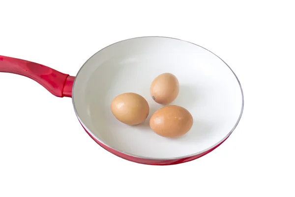Three chicken eggs in a frying pan — Stock Photo, Image