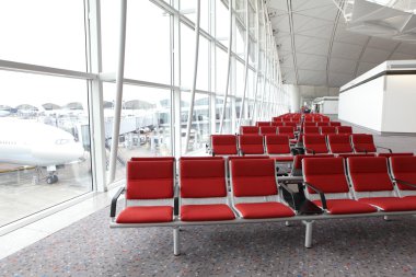 Row of red chair at airport clipart