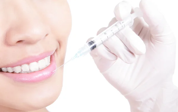 Cosmetic injection to the pretty female lips — Stock Photo, Image