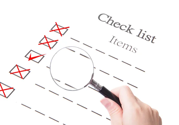 Checklist paper and magnifier glass close up — Stock Photo, Image