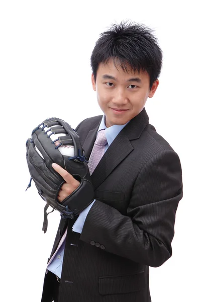 Joven hombre de negocios lanzando béisbol — Foto de Stock