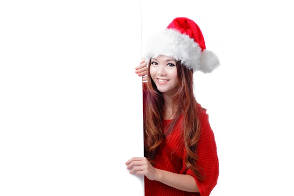 Різдвяна жінка посміхається показуючи рекламний щит — стокове фото