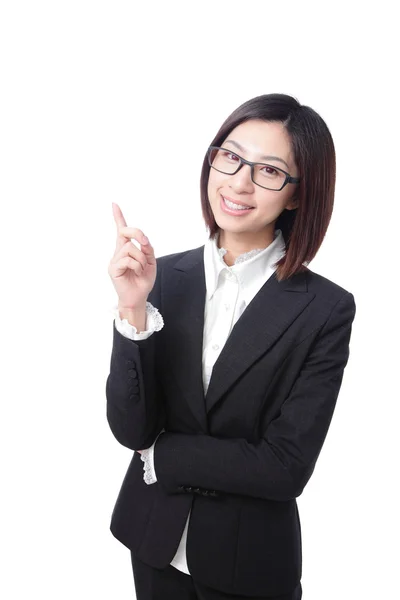 Business woman pointing at something in the air — Stock Photo, Image