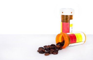 Coffee beans spilling out of a perscription bottle clipart