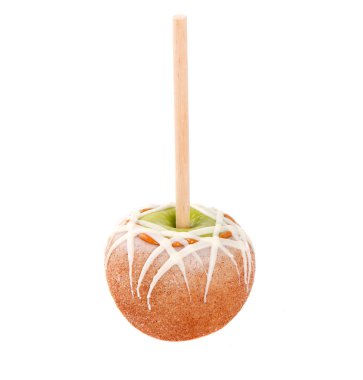 Caramel and chocolate covered apple on a stick clipart