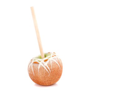 Caramel and chocolate covered apple on a stick clipart