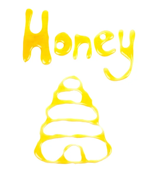 Слово мед і фото бджолиного вулика з меду — стокове фото