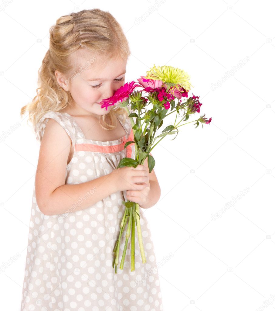 Little girl smelling flowers — Stock Photo © sjhuls #10967223