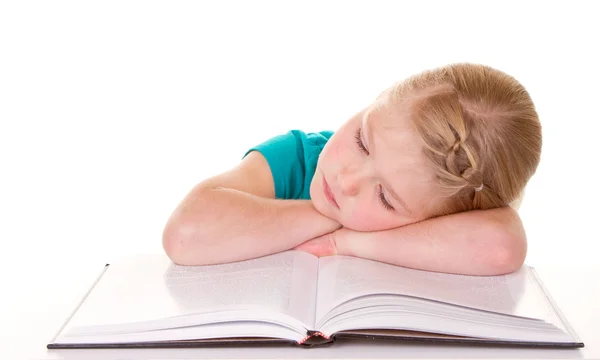 Uma menina se cansando de ler — Fotografia de Stock