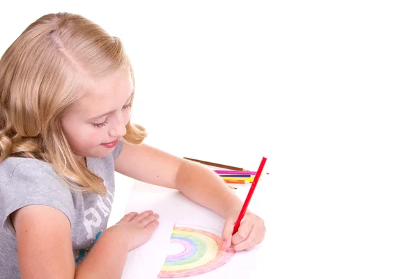 Oudere meisje of tiener tekening een regenboog — Stockfoto