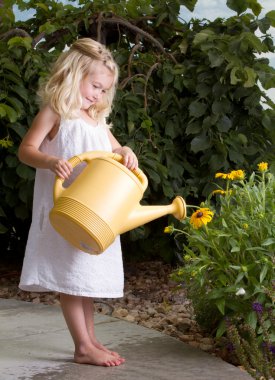 Young girl watering flowers clipart