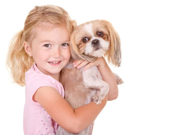Young girl holding pet dog — Stock Photo, Image