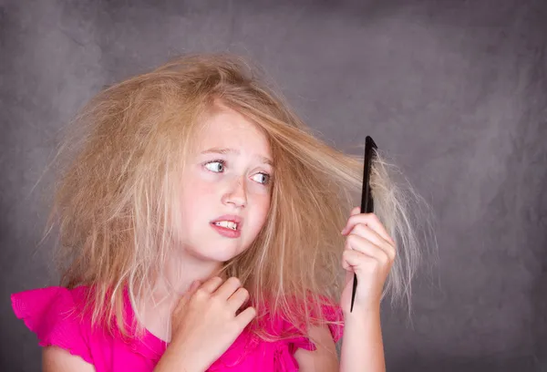 Girl with crazy tangled hair — Stock Photo, Image