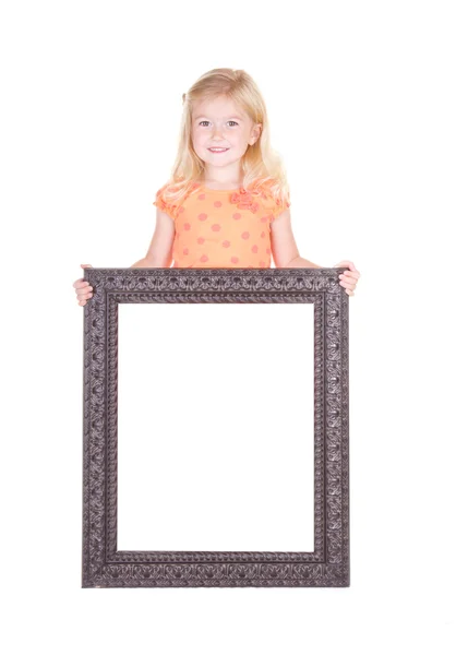 Criança segurando grande quadro em branco — Fotografia de Stock