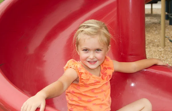 Little girl on slide — Stock Photo, Image