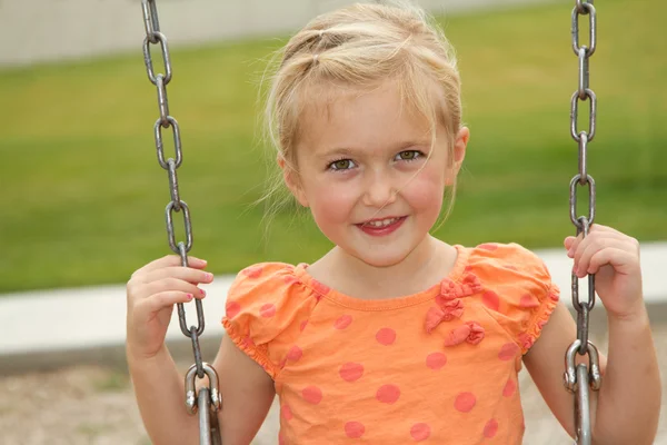 Close-up of girl on swing — Stock Photo, Image