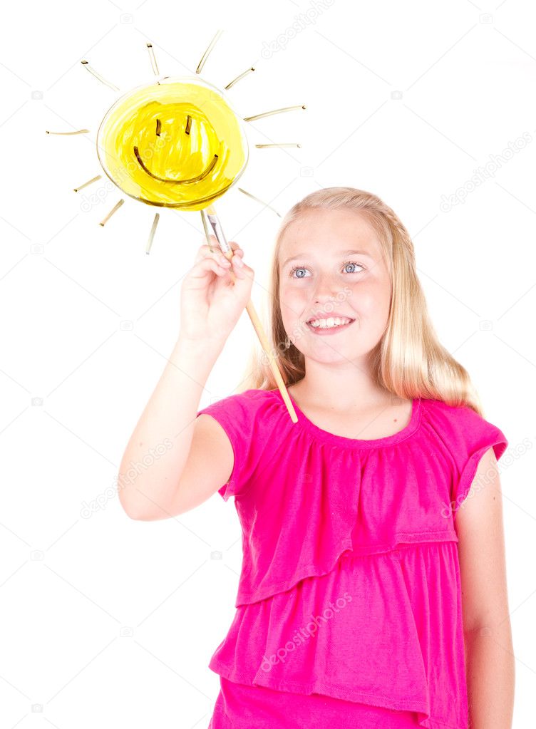 Girl painting sun on a window