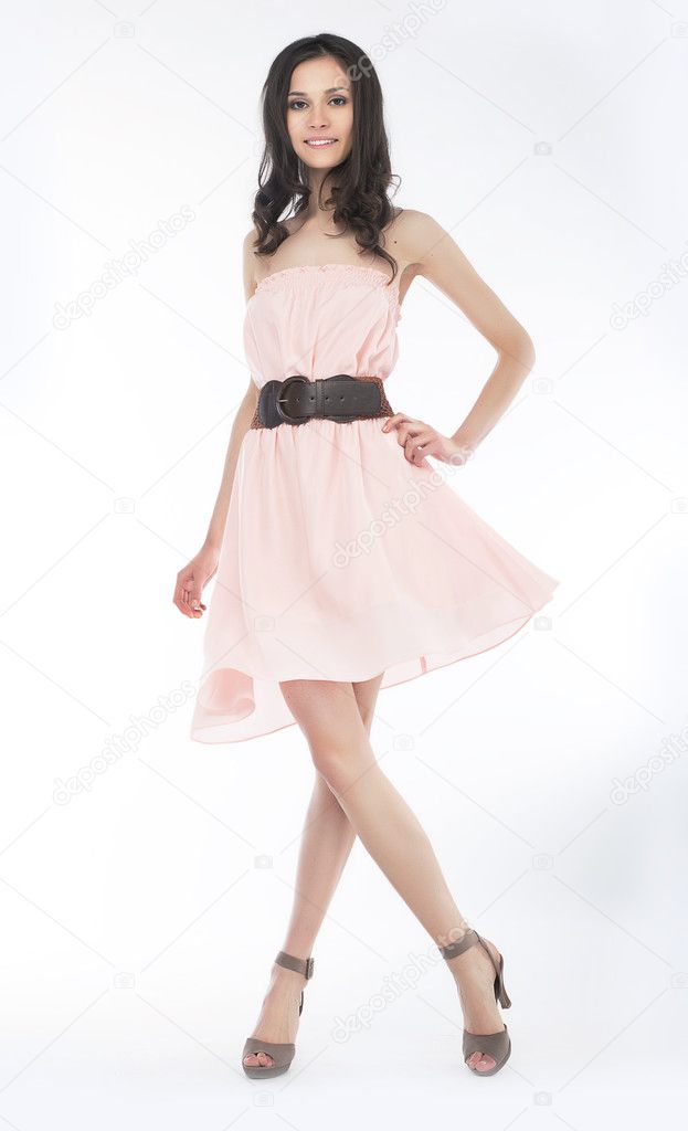 Sensual young woman in trendy dress posing