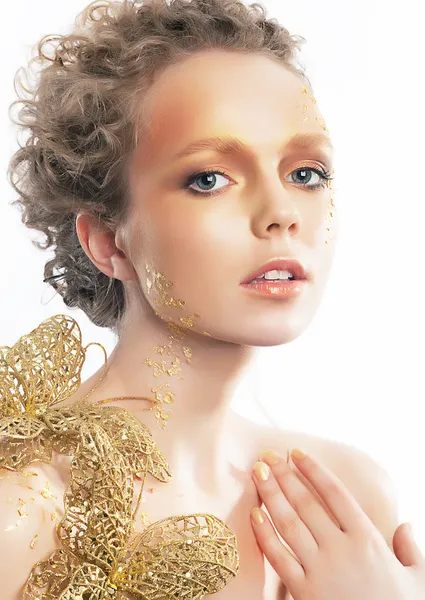 Guld ljusa make-up. skönhet kvinna ansikte. kreativitet — Stockfoto