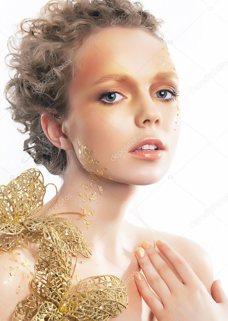 Gold bright make-up. Beauty woman face. Creativity