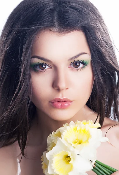 Beauty. Sensual woman face with bouquet of flowers — Stock Photo, Image