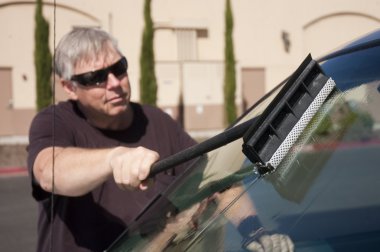 Man cleaning windshield clipart