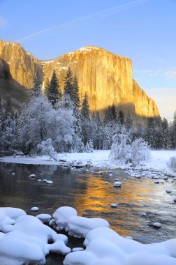 Sun set on the granite peaks in Yosemite valley clipart