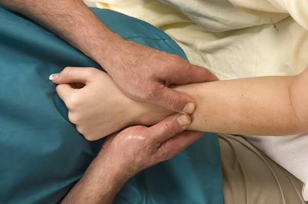 Woman having arm massaged